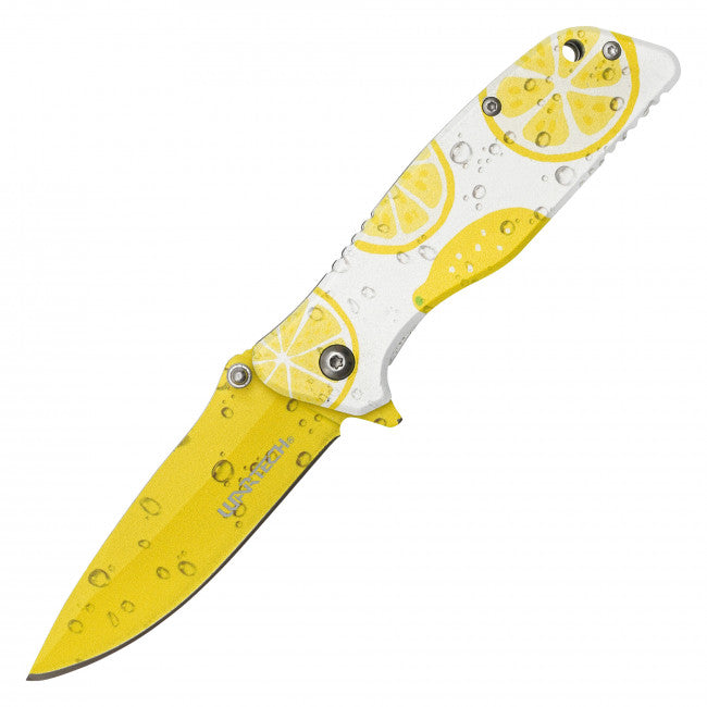 A folding pocket knife with a bright yellow and white lemon slice pattern, shown with water droplets on a plain white background.