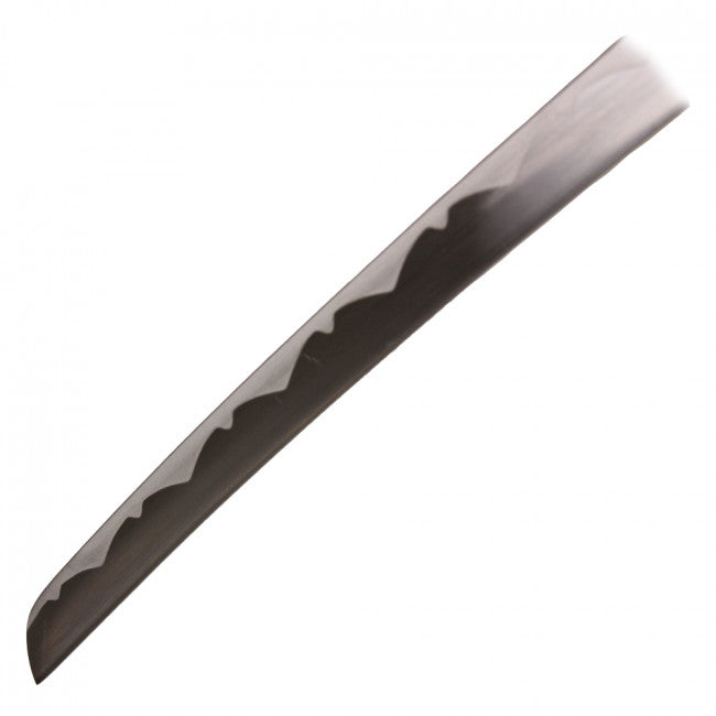  “ blade close-up showing silver-colored finish and wavy edge pattern”