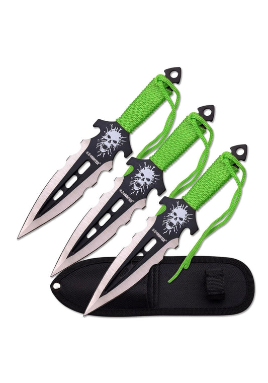 Three throwing knives with green strings and black sheaths on a white background